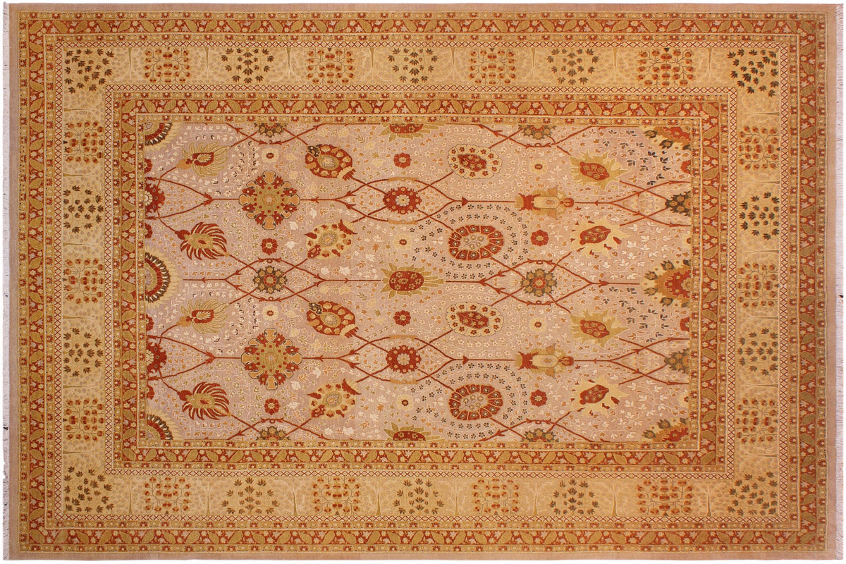 An ornate rectangular area rug with a cream and beige field, decorated with intricate red, orange, and brown floral and geometric patterns, surrounded by a wide matching border.
